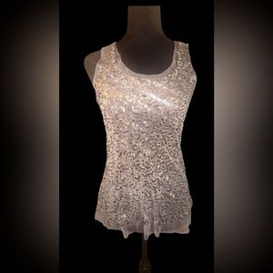 Sequined, sheer layered top
. Sparkles at every angle.